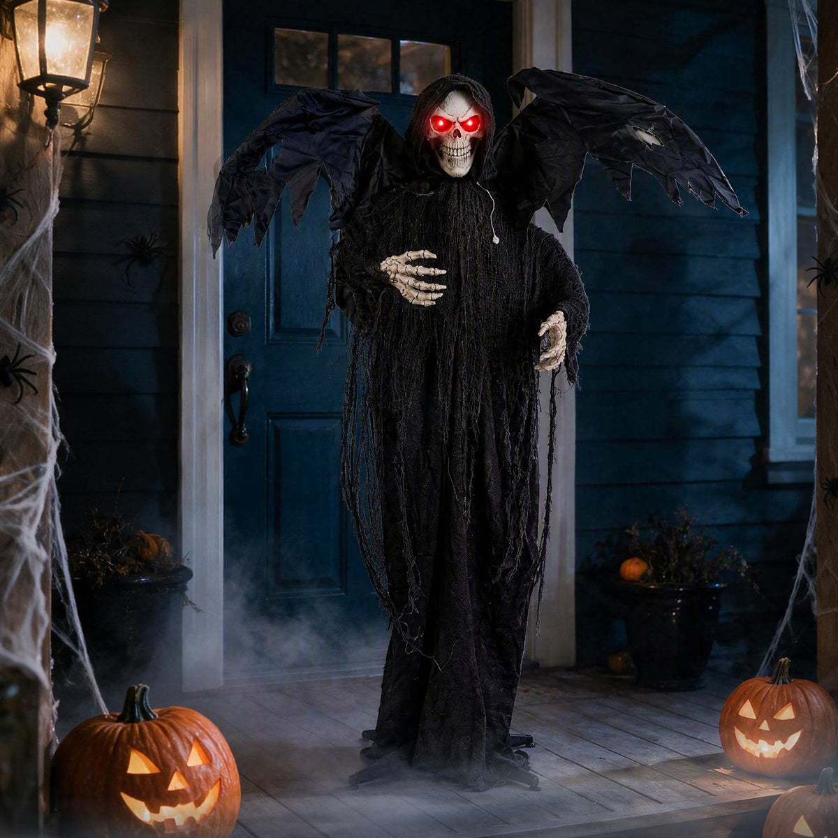 A winged reaper with glowing red eyes stands before a dark blue door, with fog and carved pumpkins nearby.