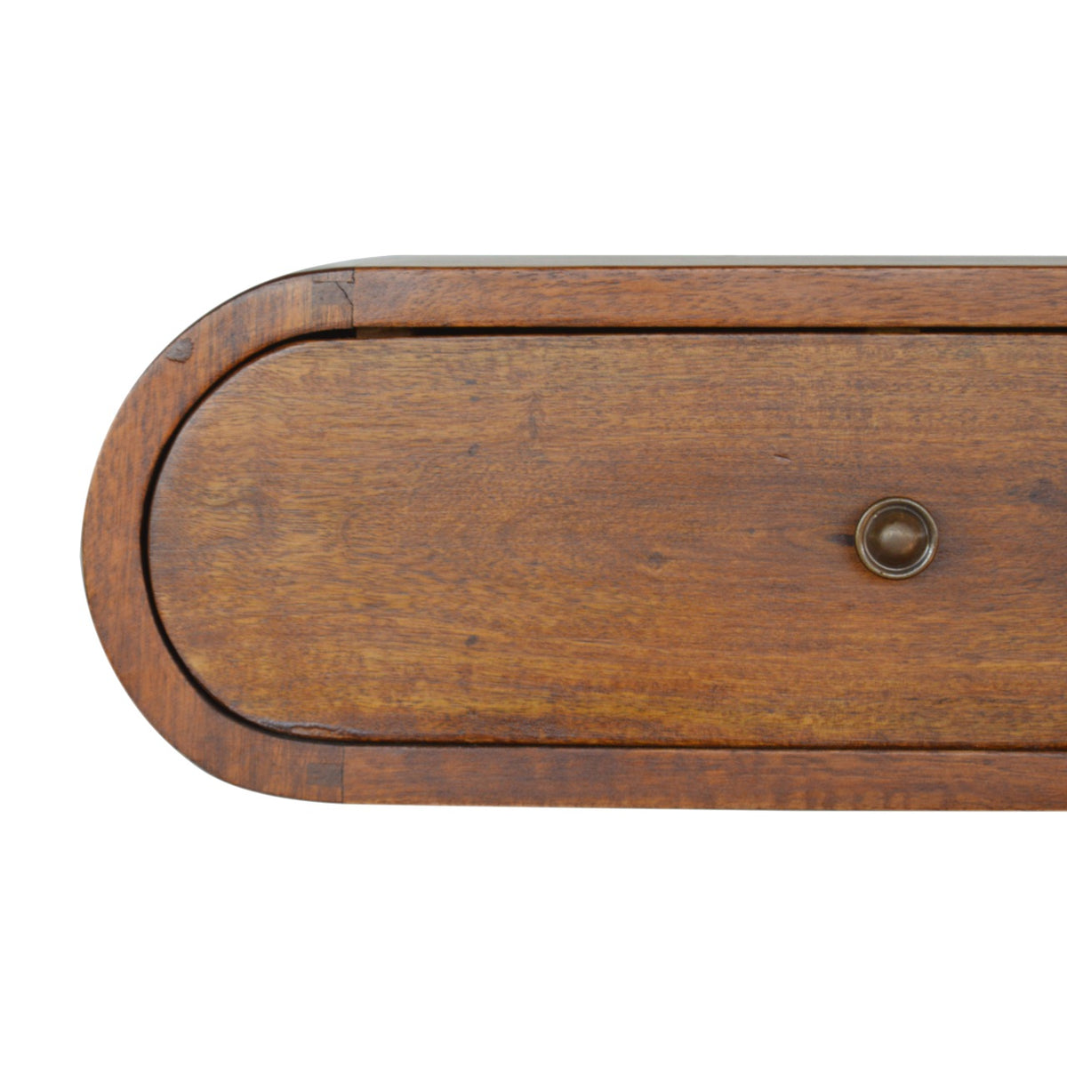 Close-up of the chestnut drawer front and its round shiny knob