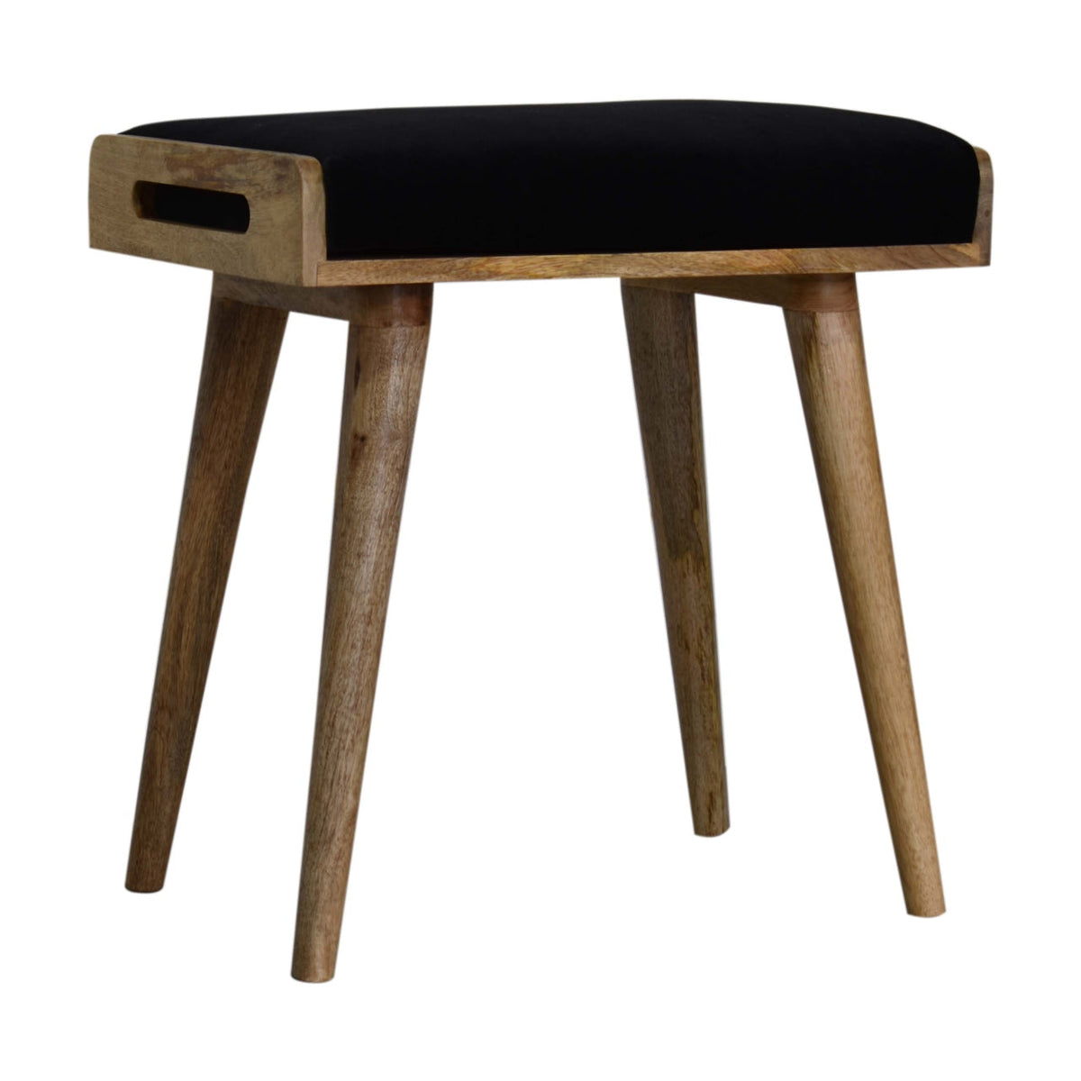 Three-quarter view showing the footstool’s black cushion, wooden side frame, and oblong handhold.