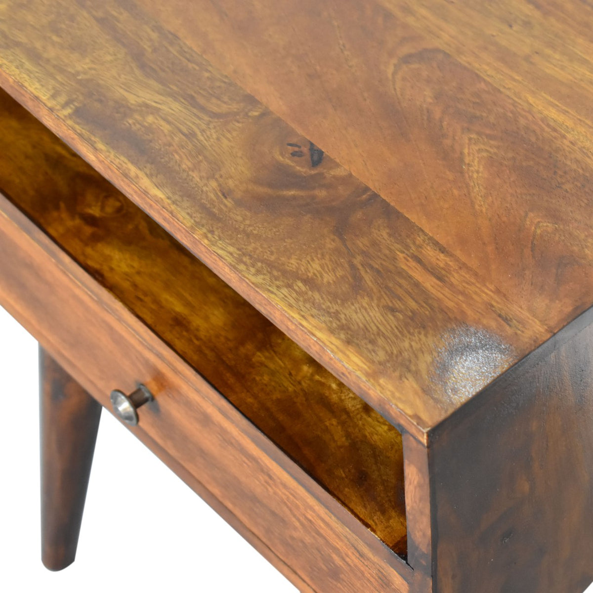 Angled close-up of the chestnut wood tabletop and open shelf