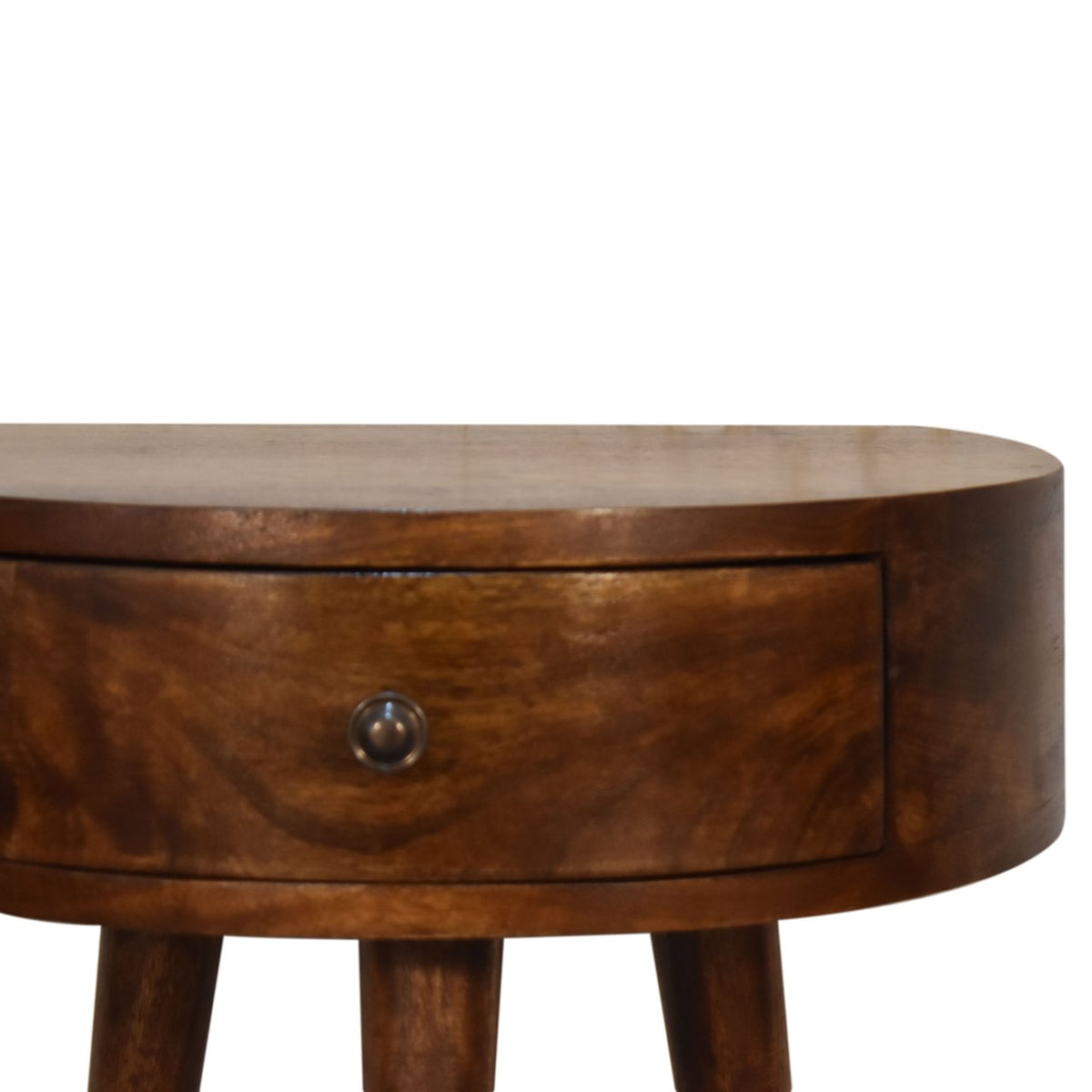 Close-up of the chestnut nightstand drawer front and shiny knob