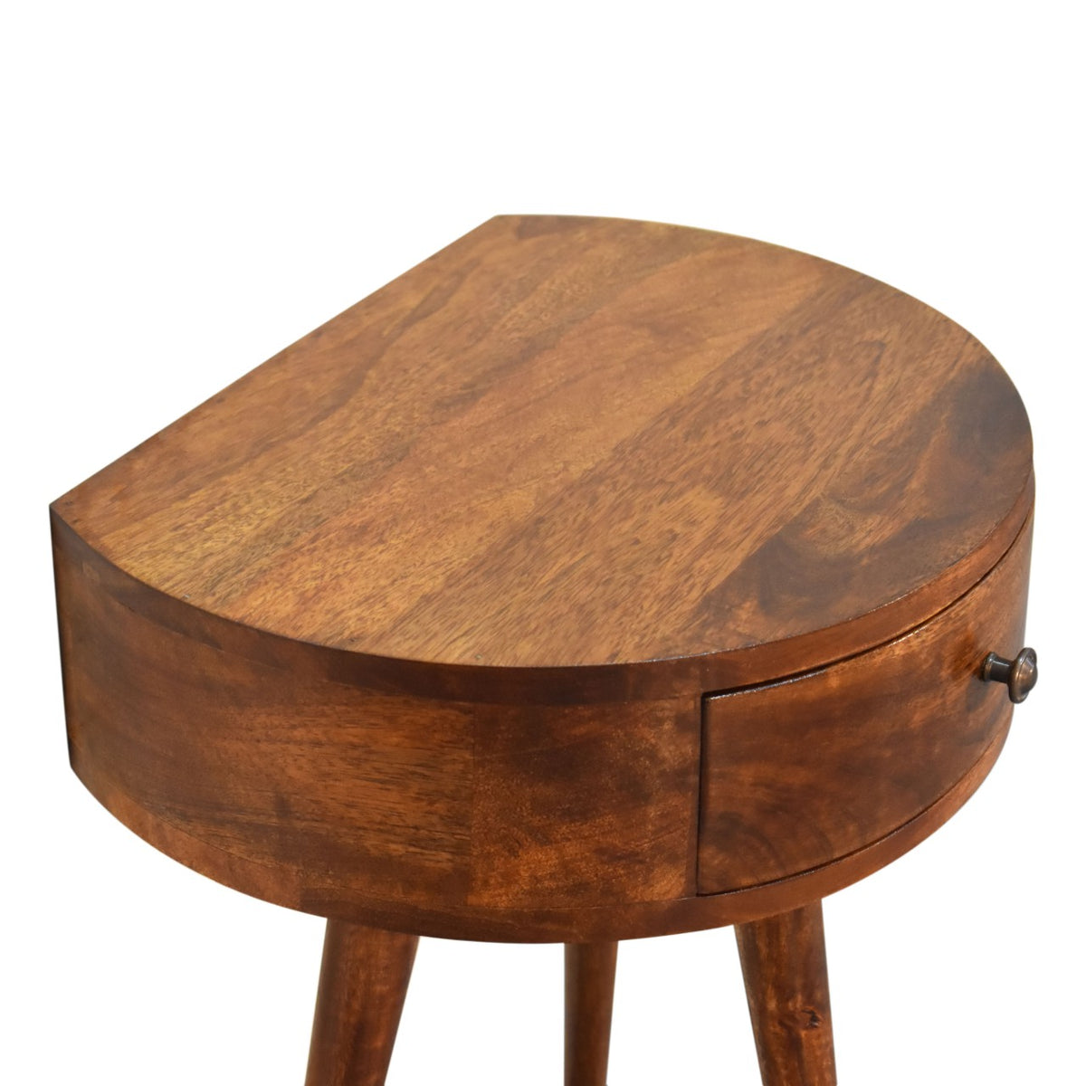 Angled top view of the chestnut semi-circle nightstand and drawer front