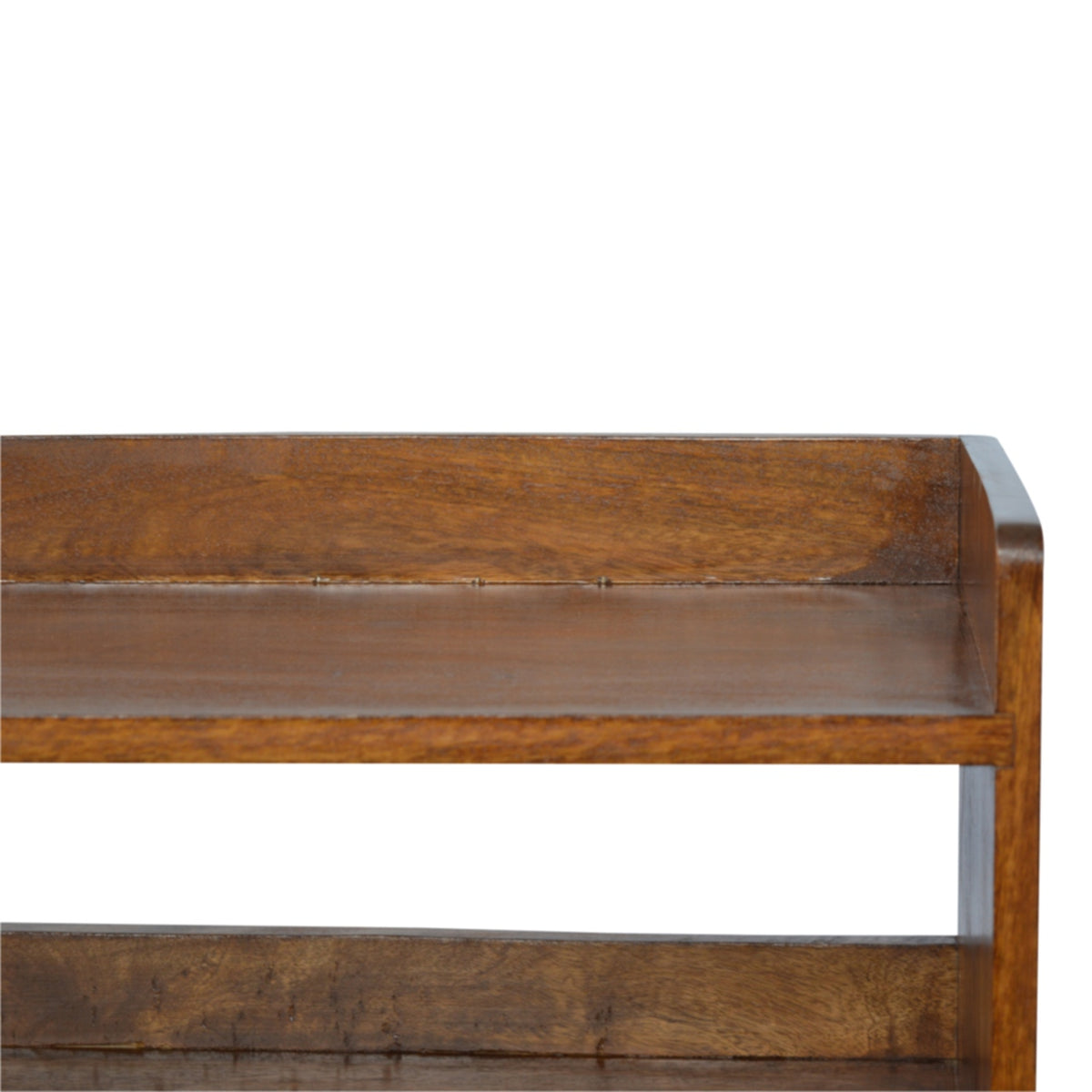 Close-up view of the chestnut bench's upper surface, side panel and open shelf