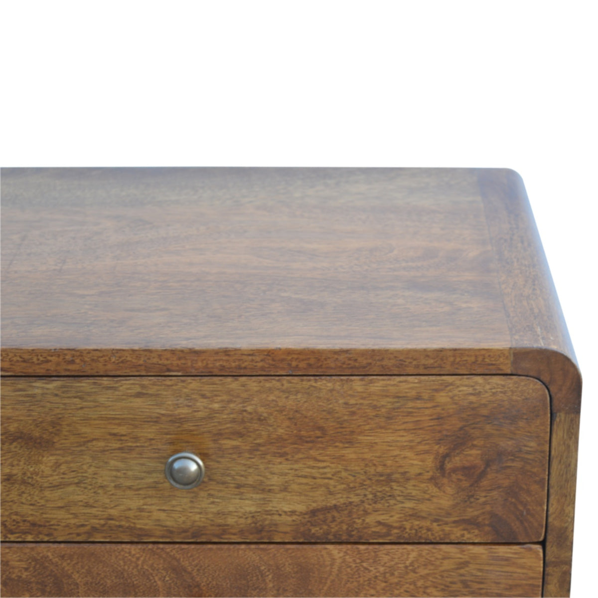 Close-up of the chestnut nightstand top and upper drawer with a shiny knob
