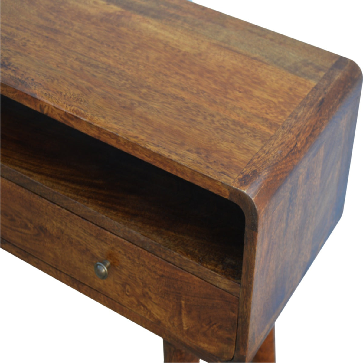 Close-up of the chestnut wood top, rounded corner, open shelf and drawer knob