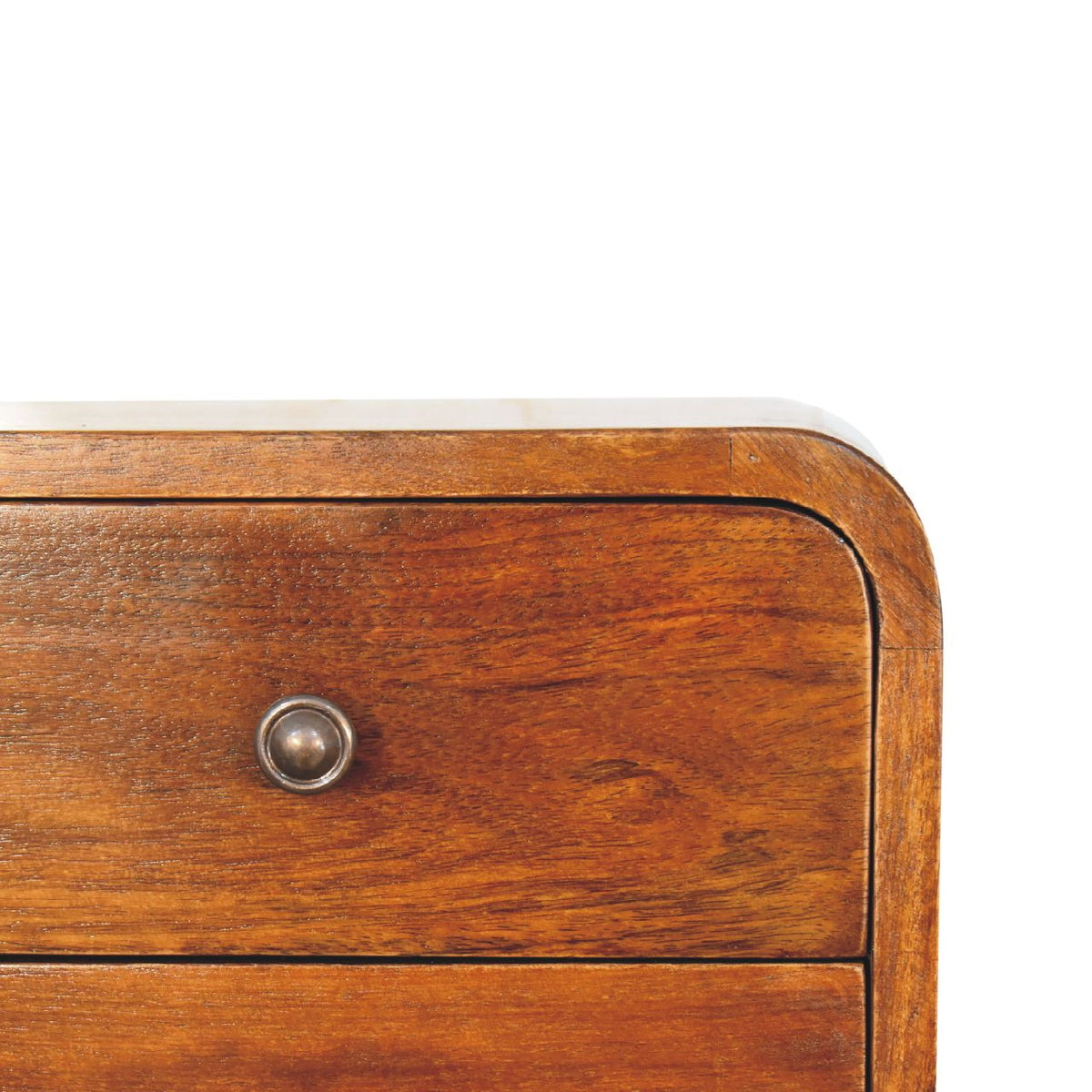 Close-up of a chestnut drawer front and its shiny round knob