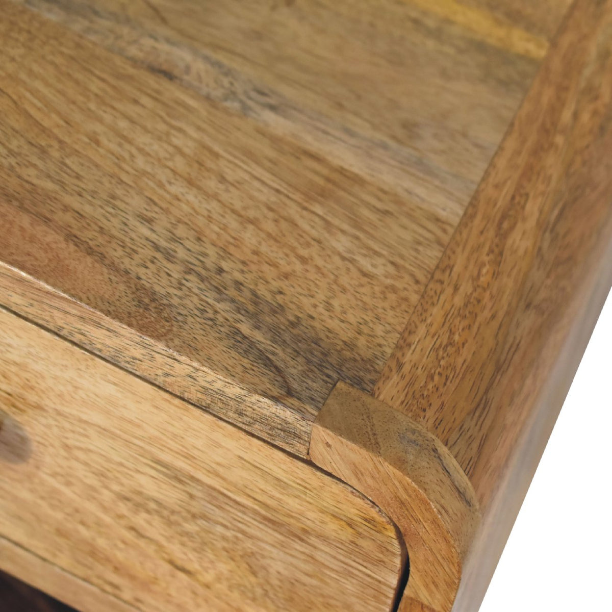 Close-up view of the wood top and rounded corner of the nightstand