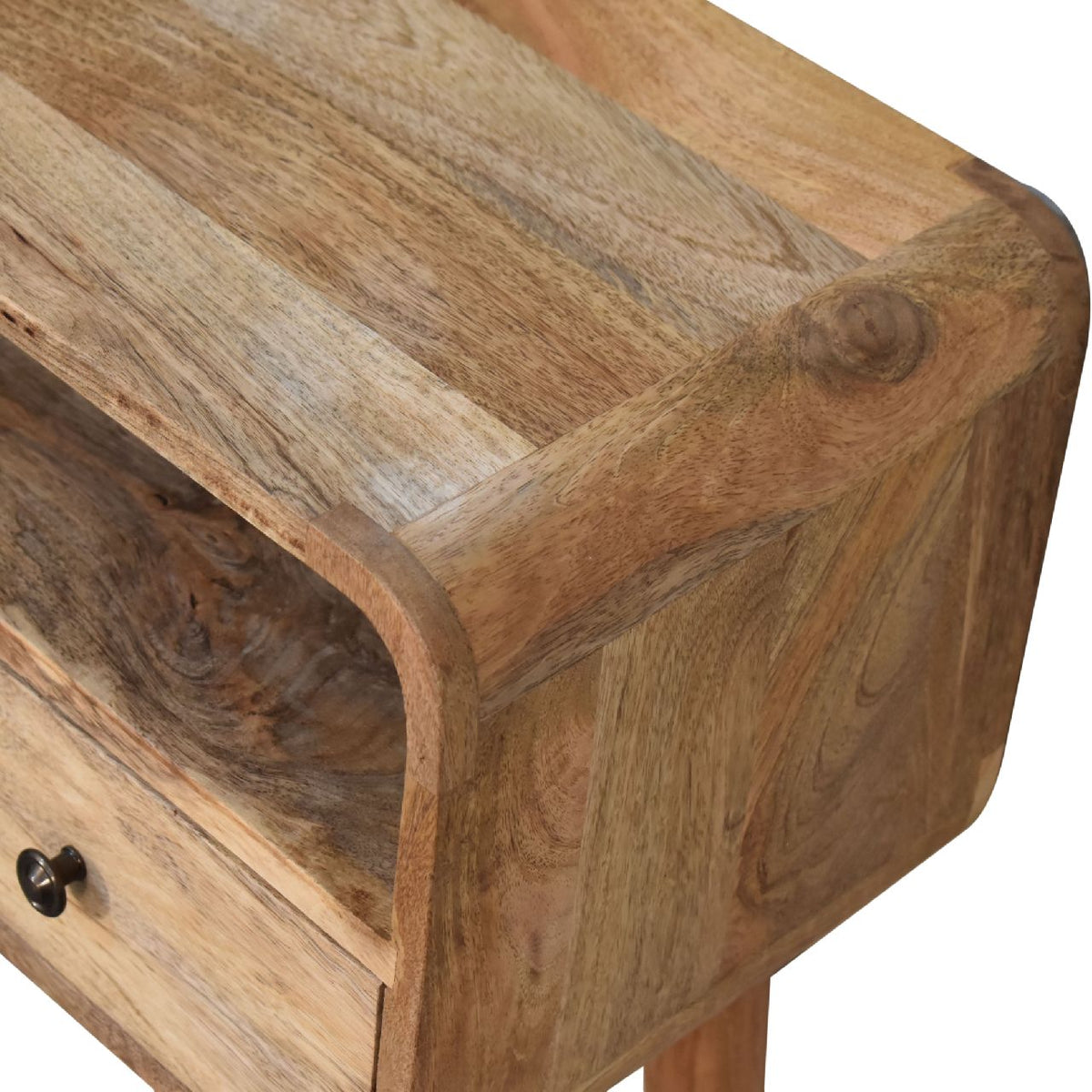 Close-up view of the console table's rounded wood corner and top