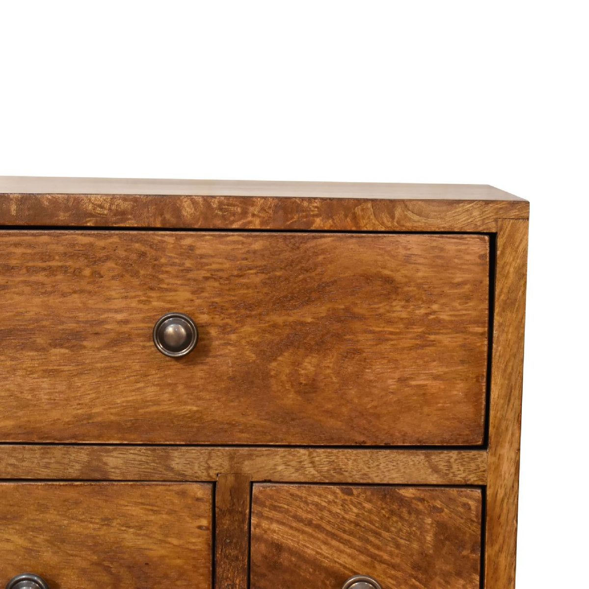 Close-up of the chestnut nightstand's upper drawer, round knob and wood grain