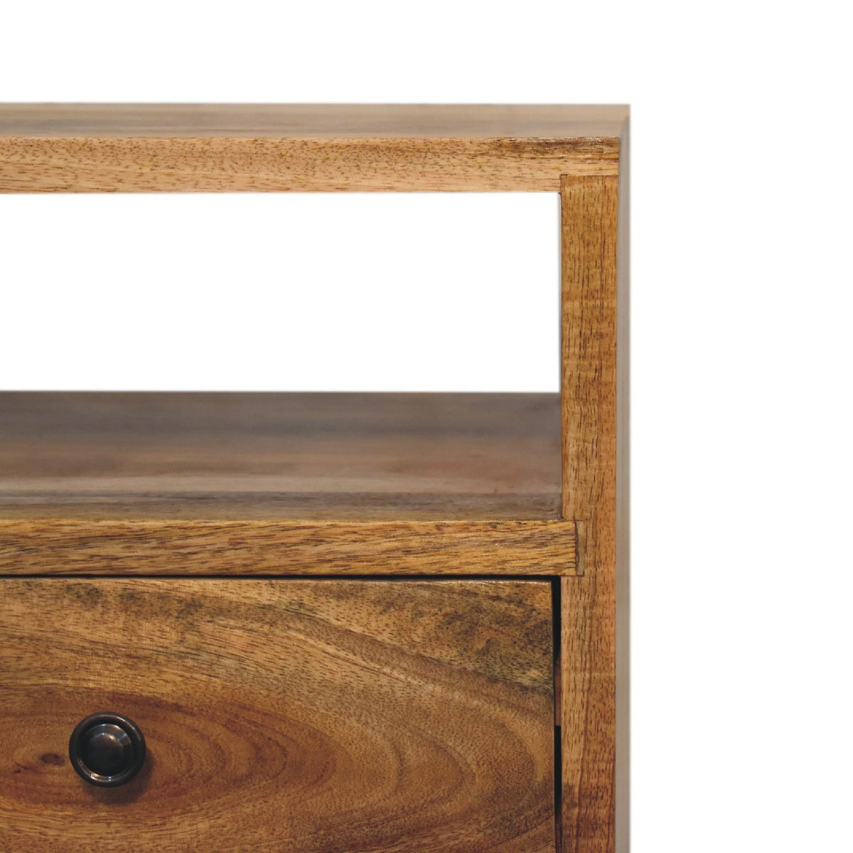 Close-up of the open shelf, wood grain and upper drawer knob