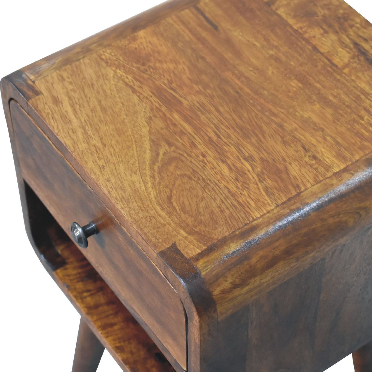 Close angled view of the chestnut wood top and drawer knob
