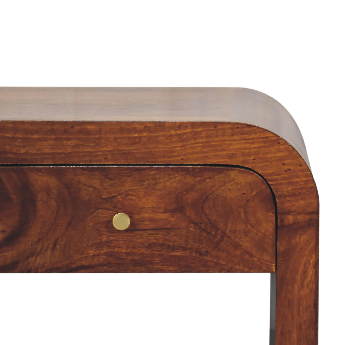 Close-up of a rounded drawer front and brass knob on the brown table