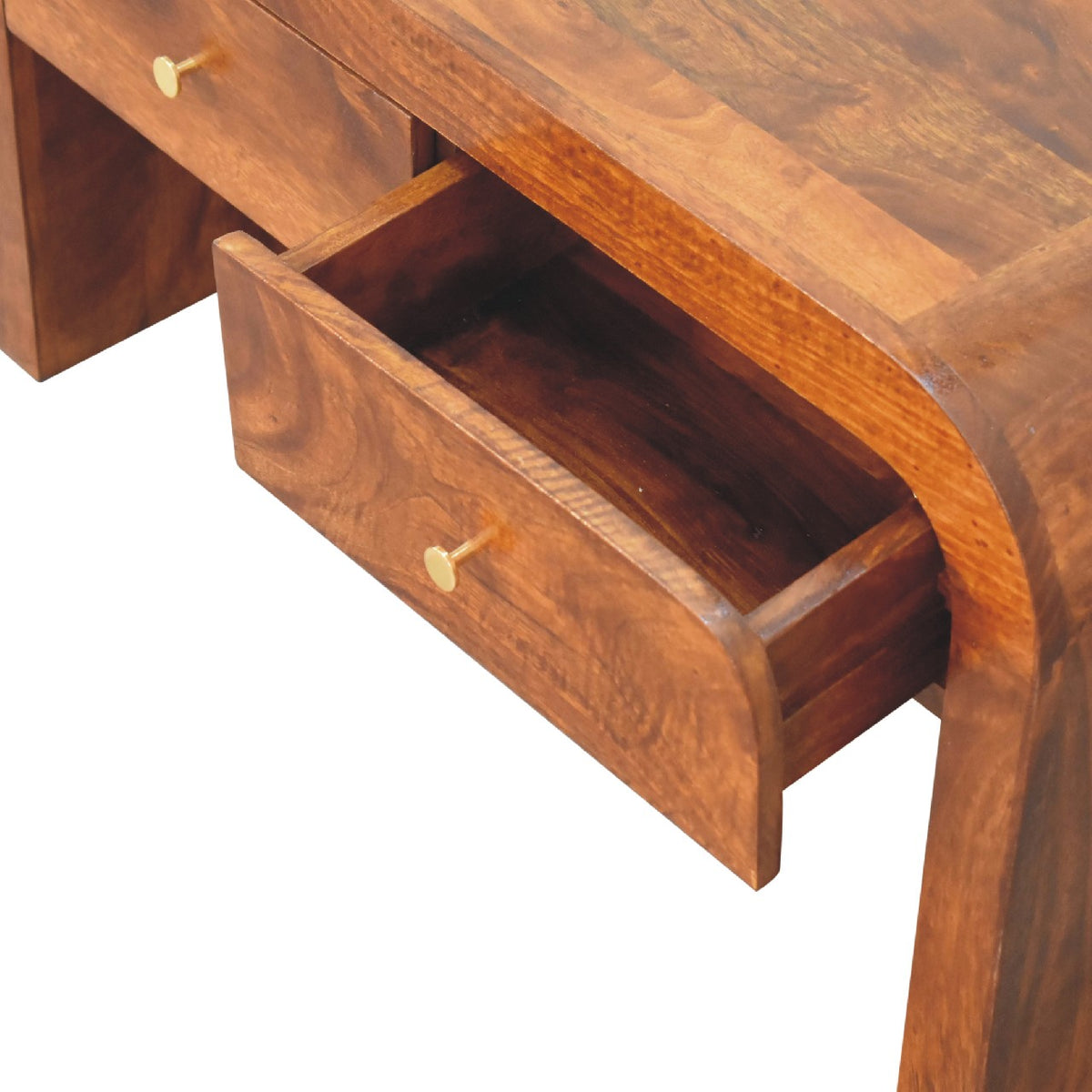 Open drawer showing its interior and brass knob on the brown coffee table