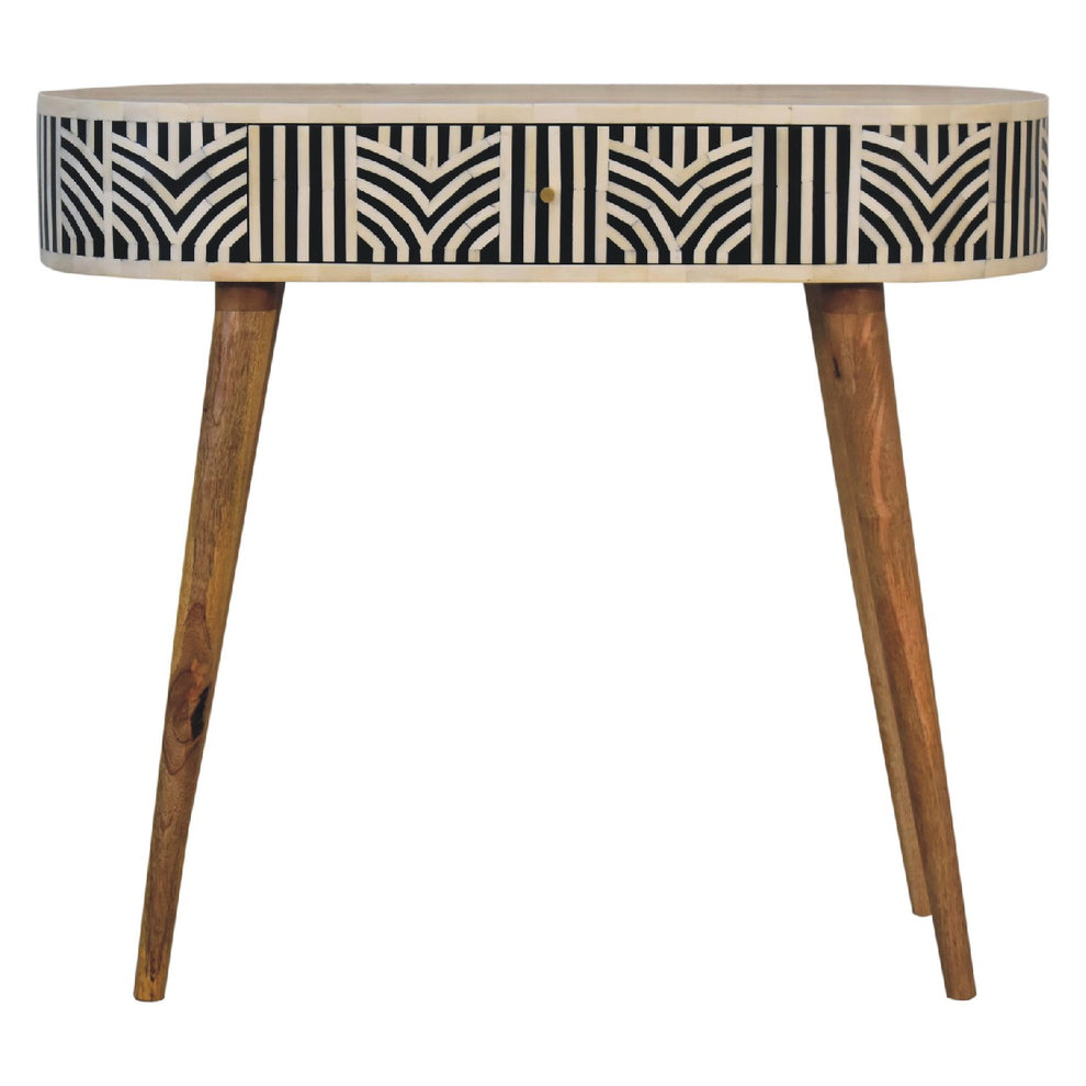 Black-and-cream bone inlay console table, straight-on view with tapered wood legs