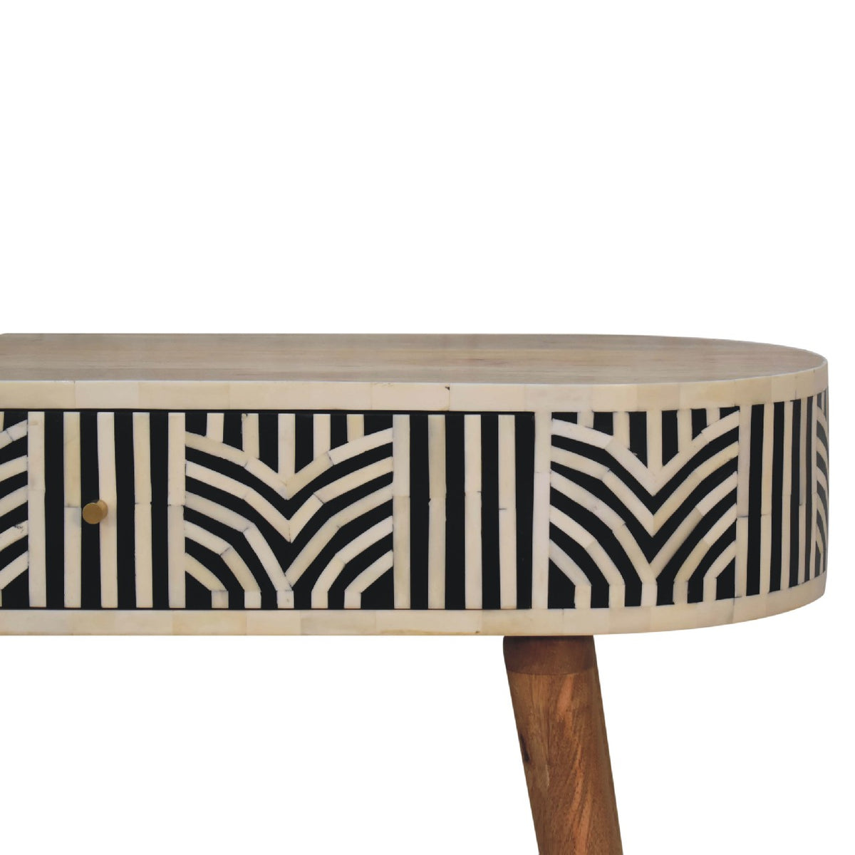 Close view of the console table's patterned drawer front and rounded wood top