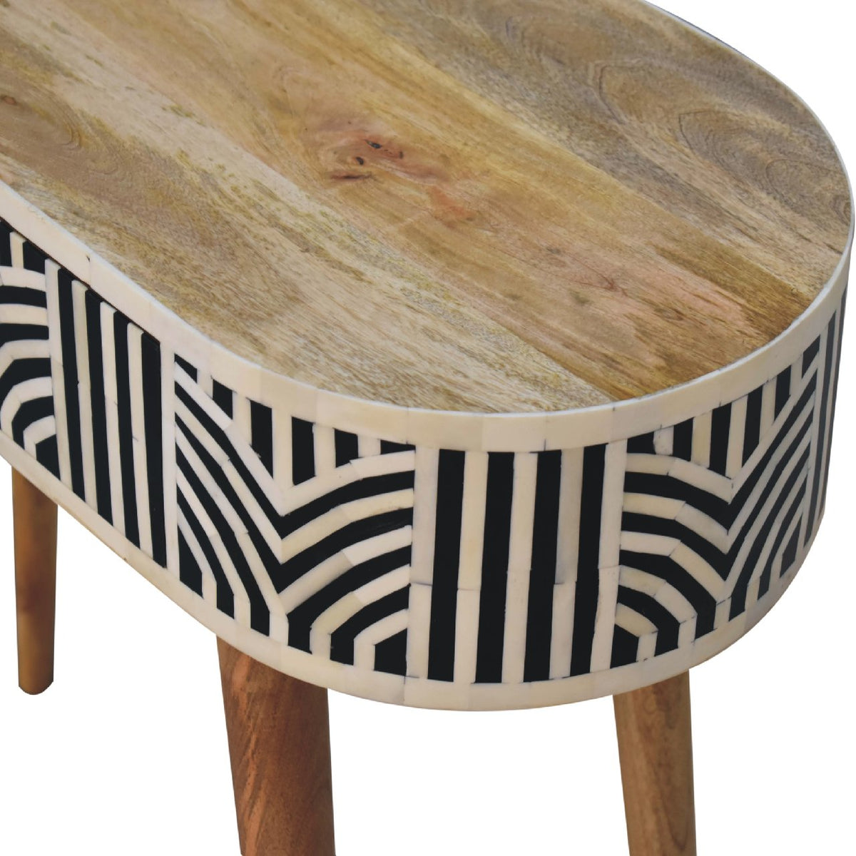 Angled close-up of the console table's wood top and geometric inlay front