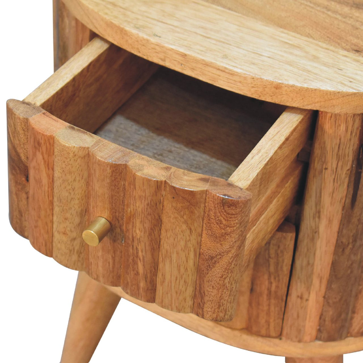 Close-up of one open drawer on the striped wood nightstand