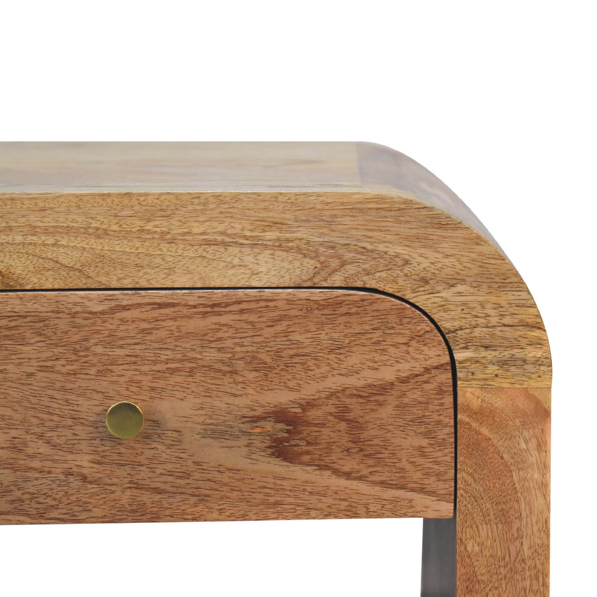 Close-up of the nightstand's rounded edge, wood grain and brass drawer knob