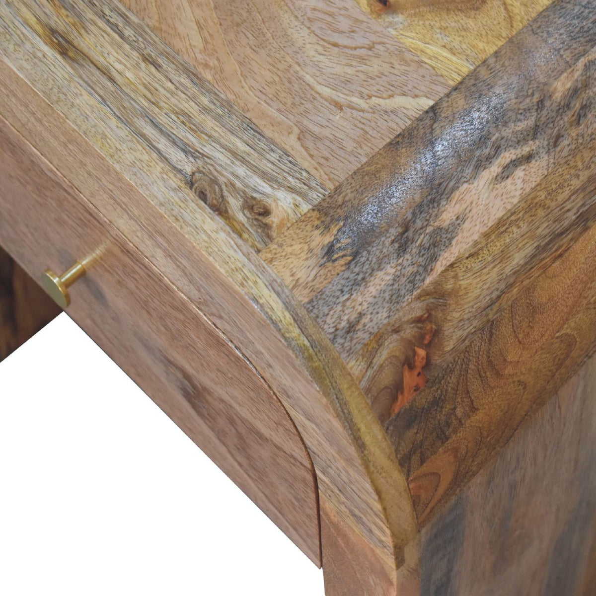 Angled close-up of varied mango wood grain across the nightstand top and side