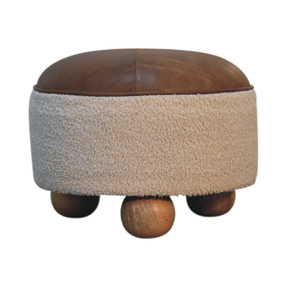 Cream boucle footstool with brown leather seat and wooden ball feet, front view
