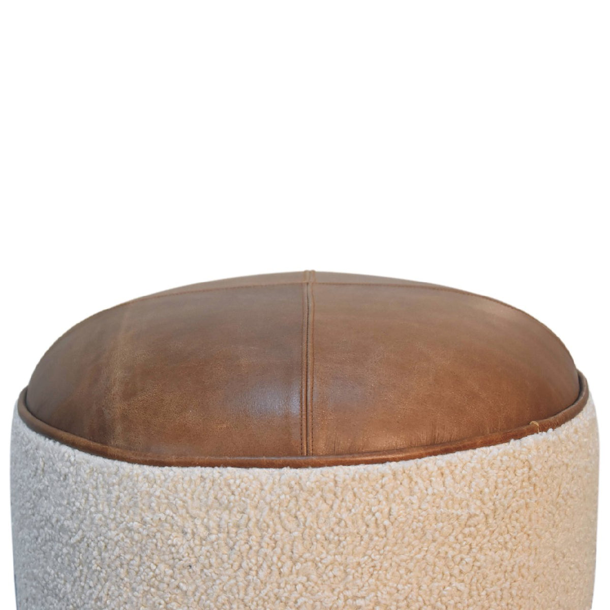 Close view of the brown leather seat and cream boucle body