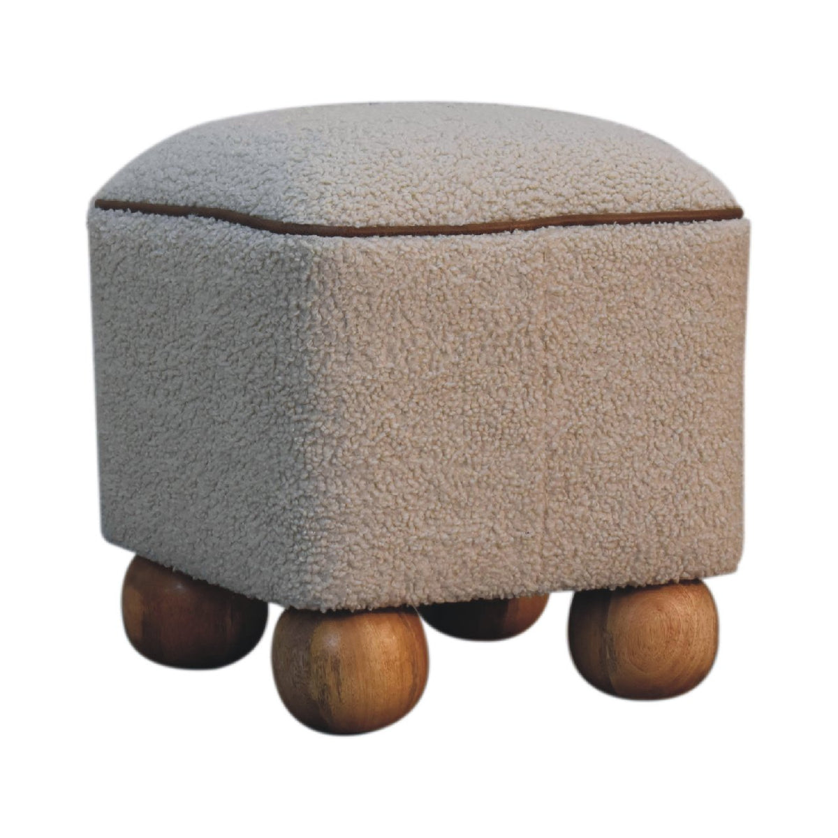 Angled view of the beige textured footstool showing its rounded body and wood feet