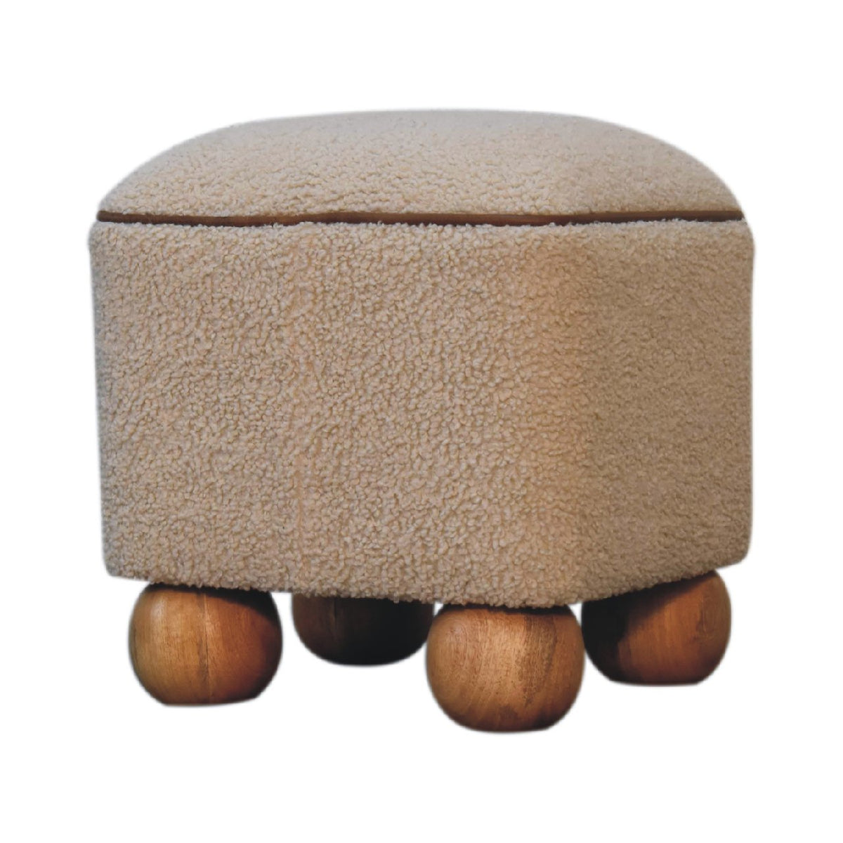 Beige footstool from a low front angle, showing brown piping and ball feet
