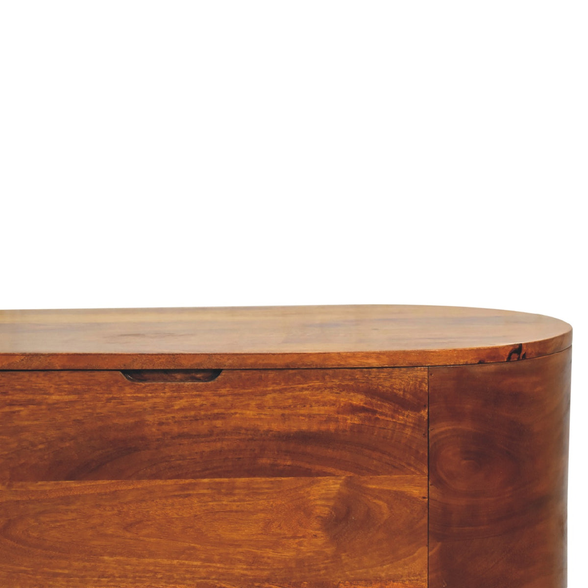 Close-up of the chestnut blanket box front, lid edge, and recessed handhold