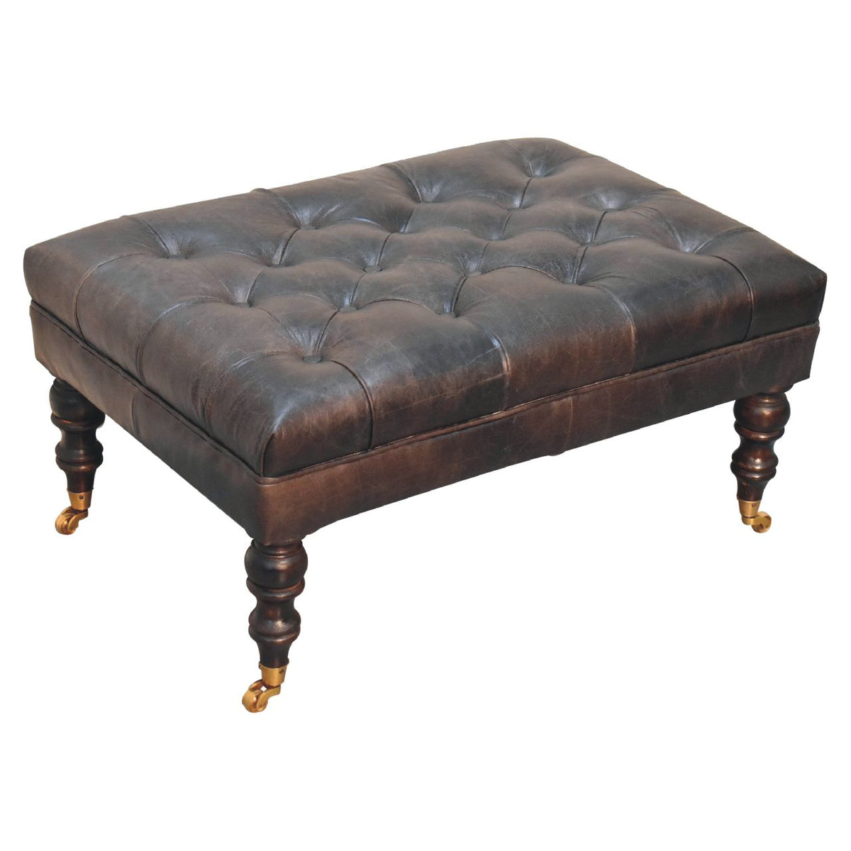Elevated three-quarter view of a dark leather deep-buttoned ottoman
