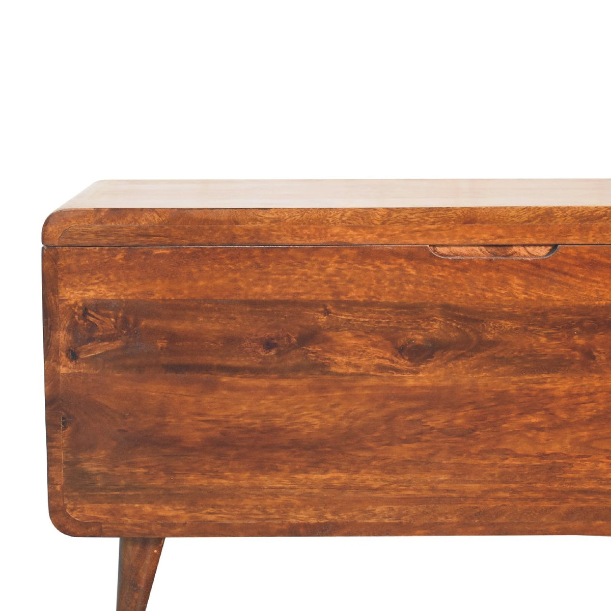 Close view of the chestnut chest front, rounded edge, and recessed pull