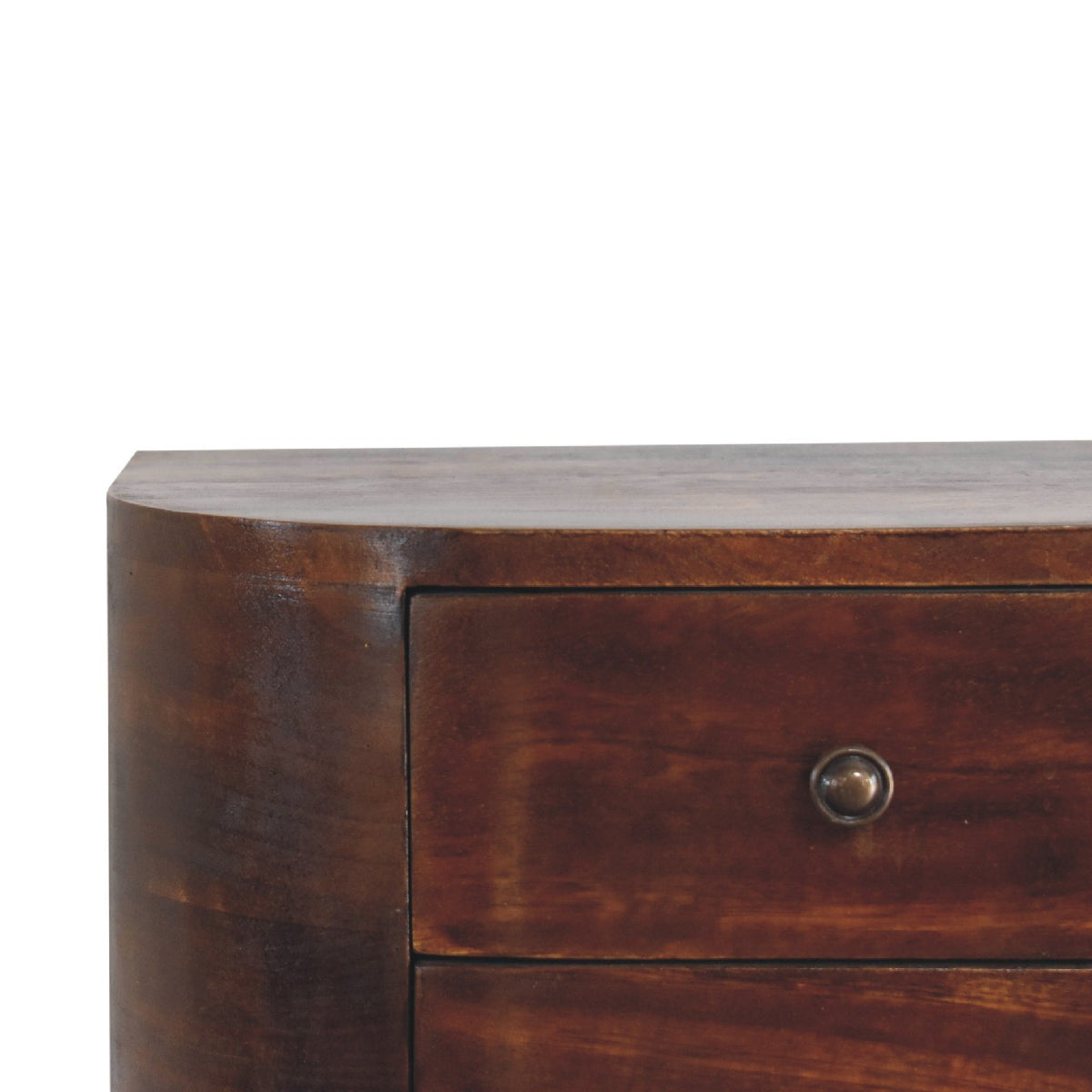 Close view of the rounded side and upper drawer on the chestnut nightstand
