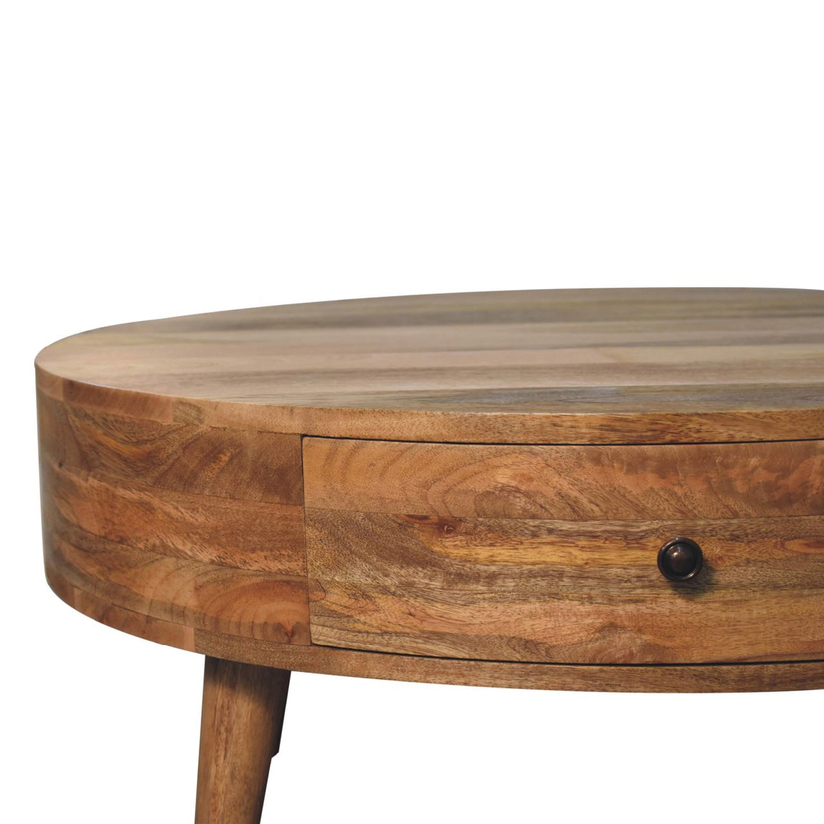 Close-up of the round table's wood drawer front and dark knob