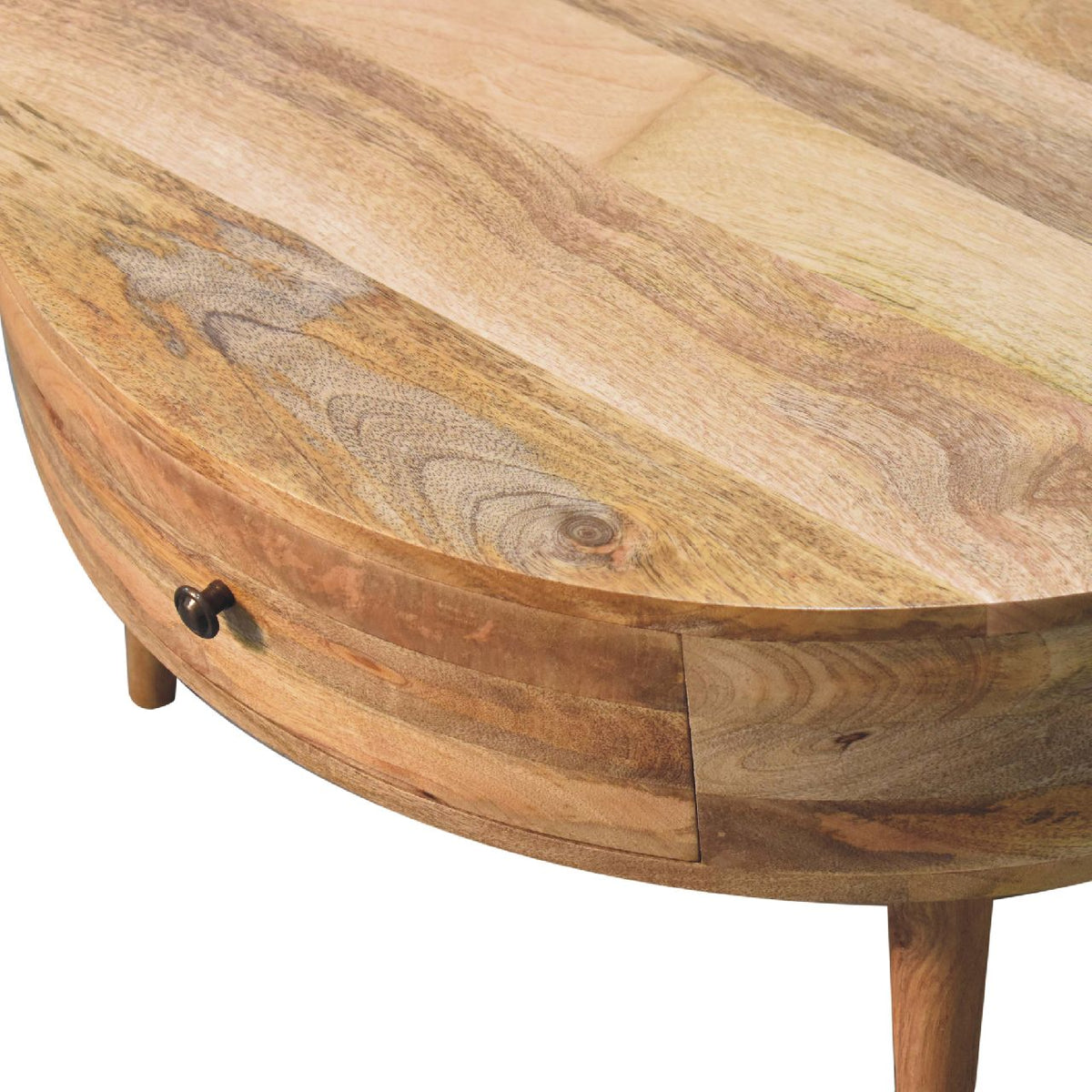 Close-up of the wood-grain tabletop edge and dark drawer knob