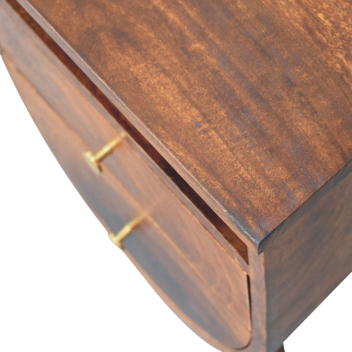 Angled close-up of the chestnut finish tabletop and brass drawer knobs