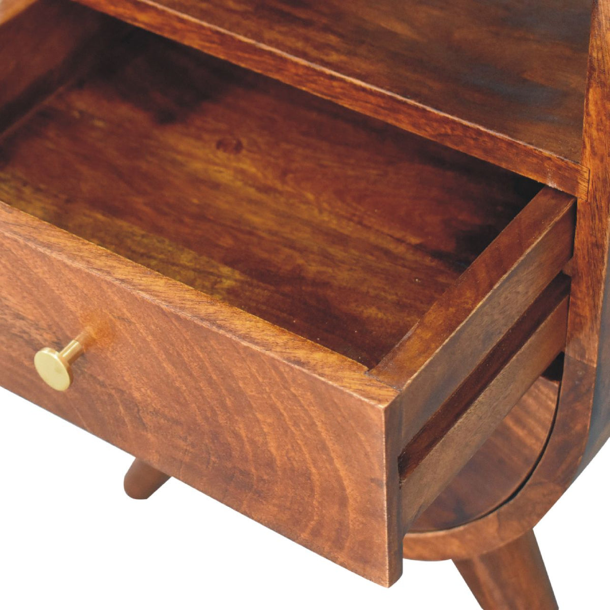 Close-up showing an open drawer and its wooden interior on the chestnut nightstand