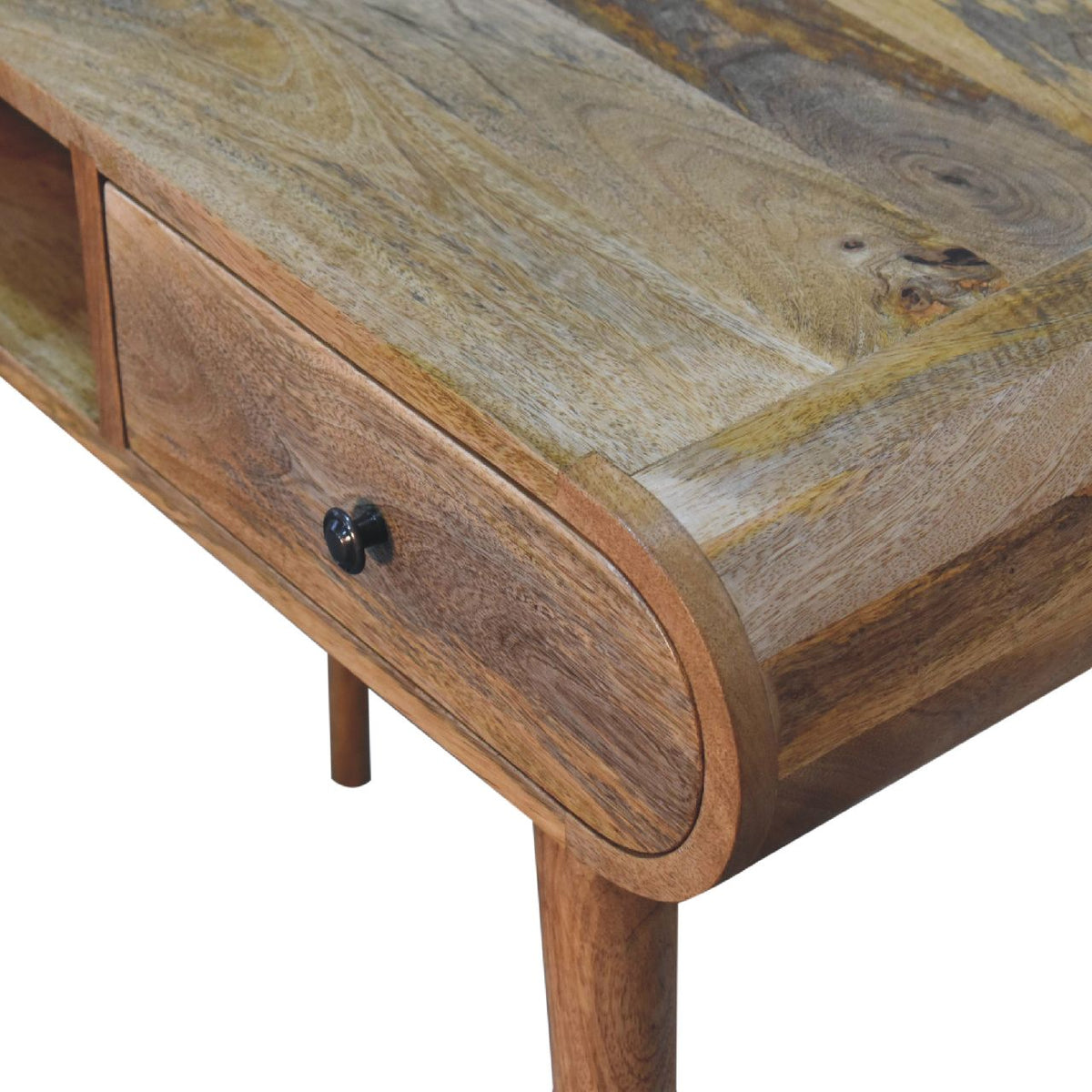 Close-up of the desk's chestnut wood grain, rounded edge, and drawer front