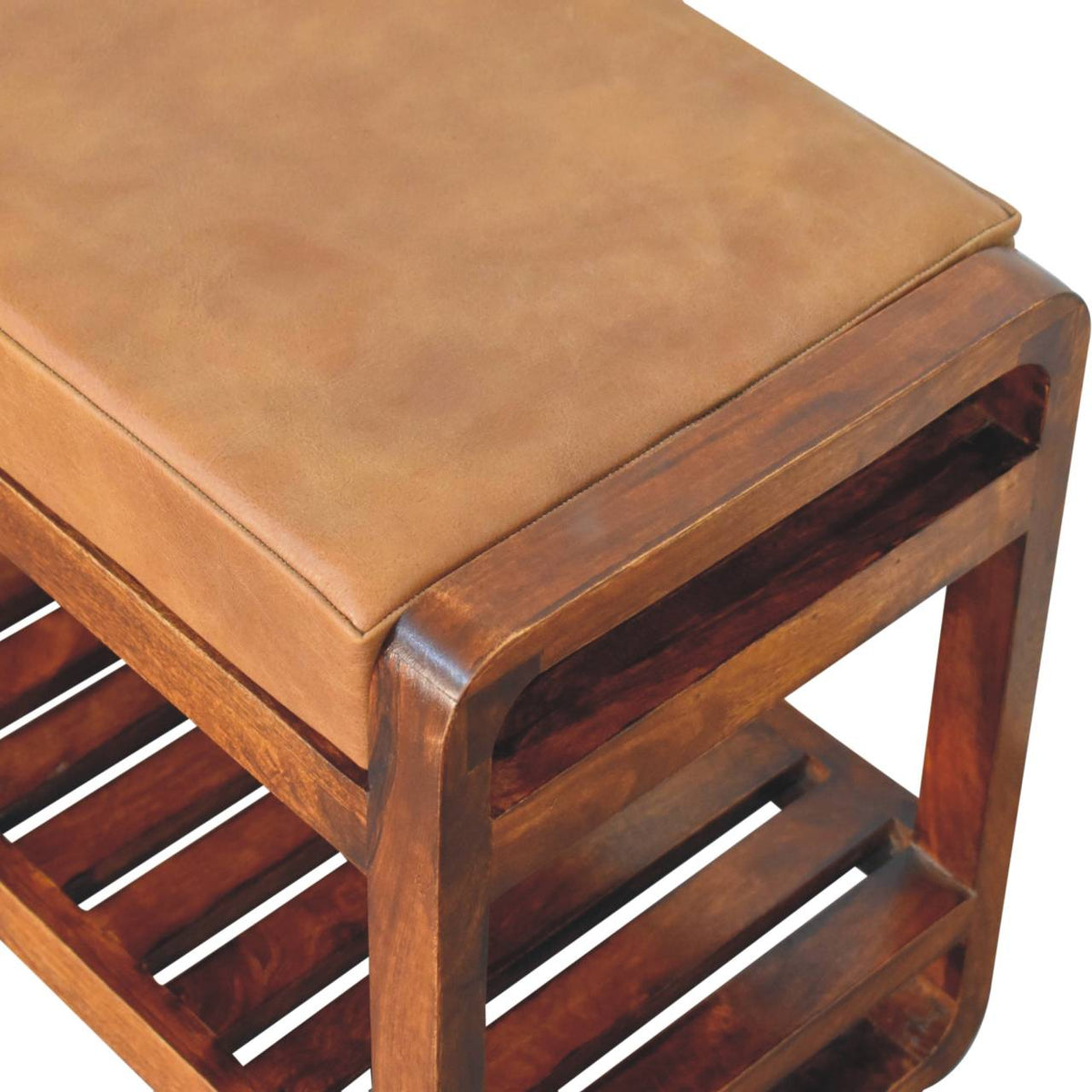 Angled close-up of the tan seat, wood side frame and slatted shelf