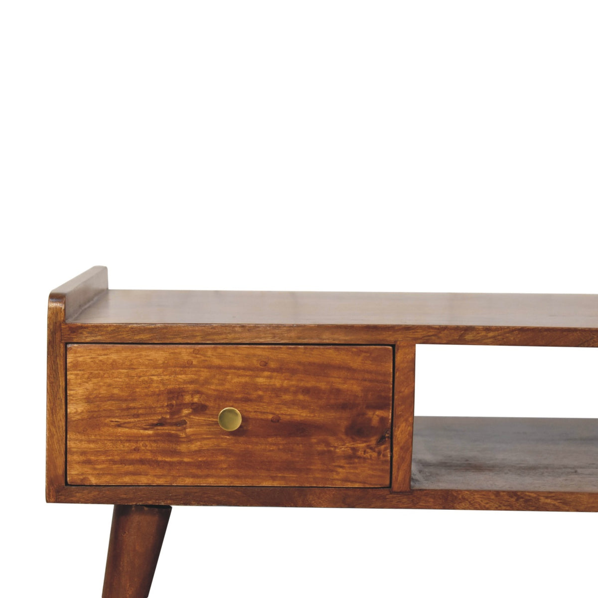 Close-up of a chestnut drawer front, round brass-tone knob and tapered leg