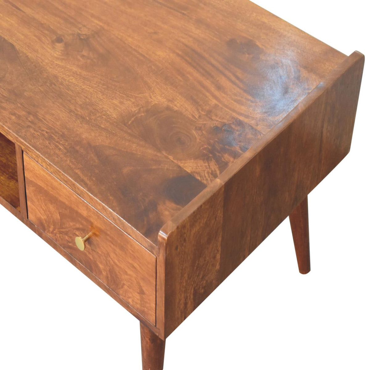Overhead angled detail of the chestnut tabletop grain and raised side edge
