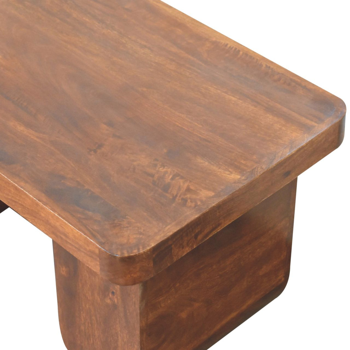 Close-up of the chestnut wood tabletop corner and rounded edge