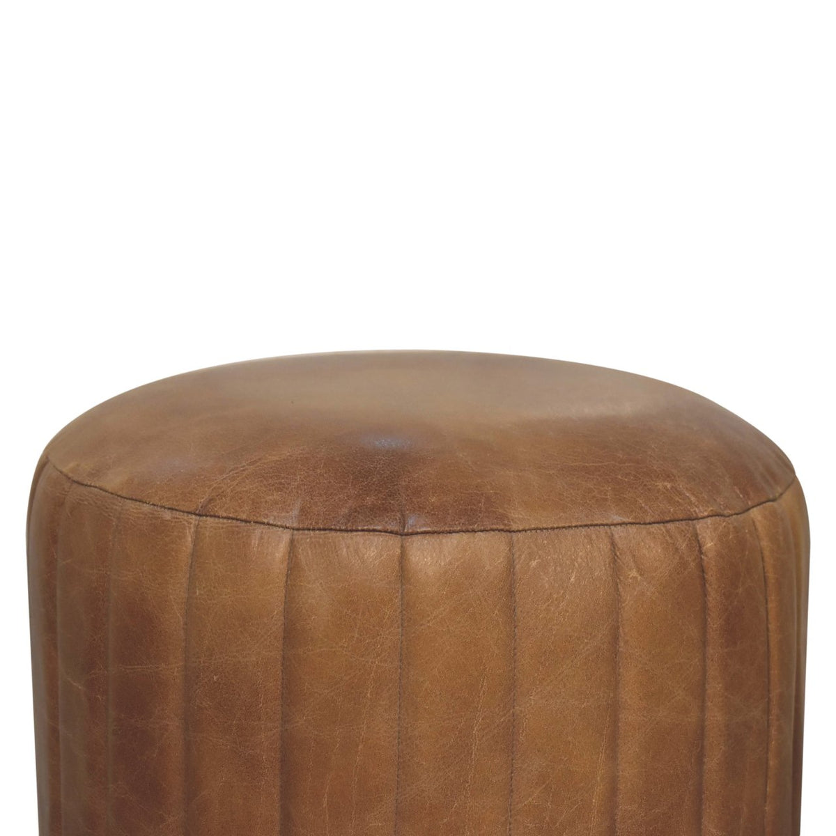 Close front view of a brown leather footstool against a white background