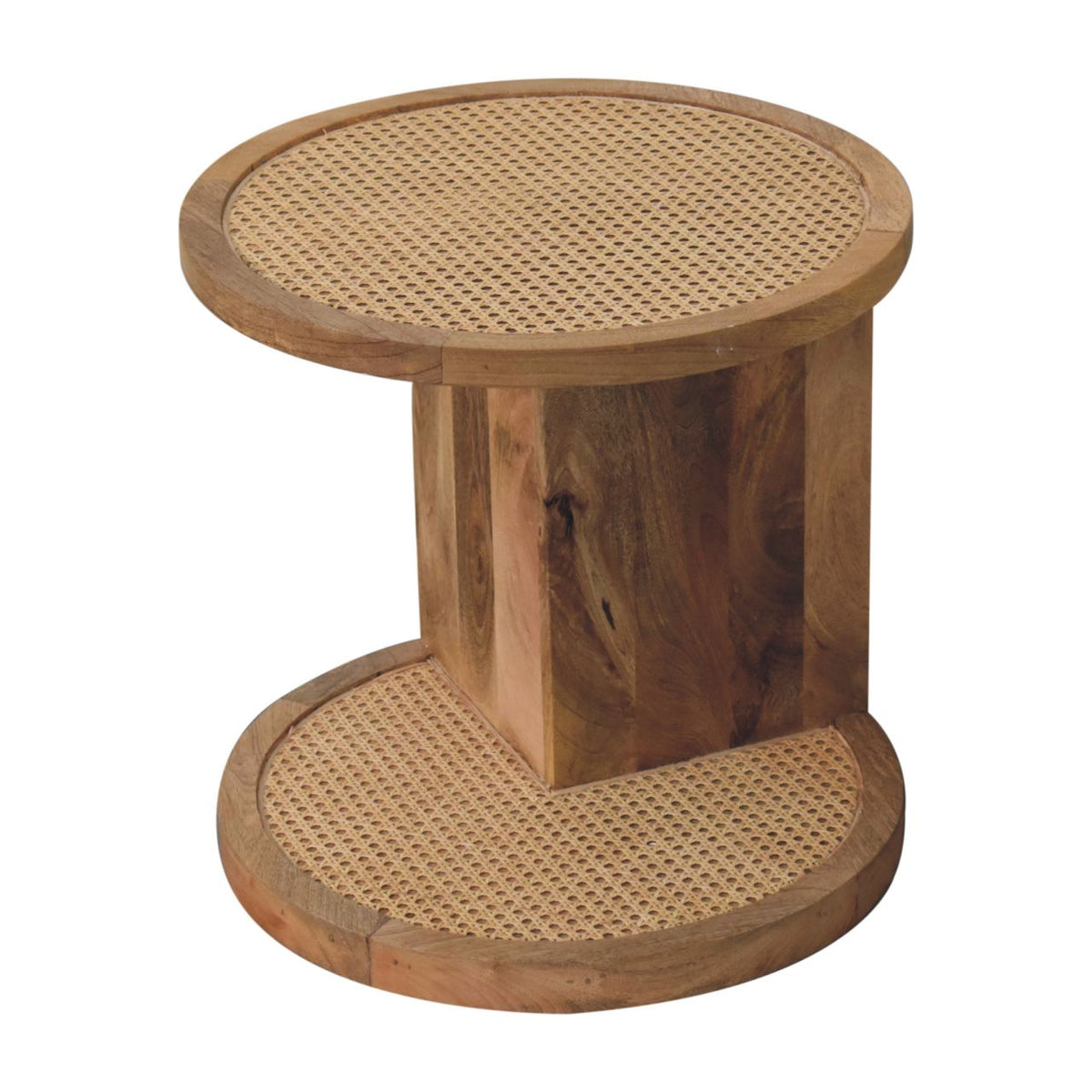 Elevated angled view of the end table showing its round patterned top and lower shelf