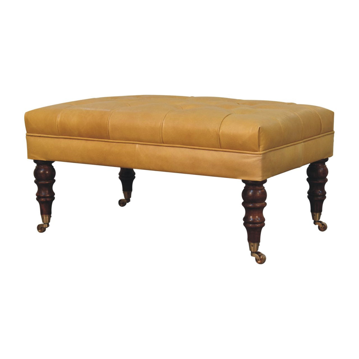 Tan leather ottoman viewed from the front corner, showing its cushioned top and four turned legs.