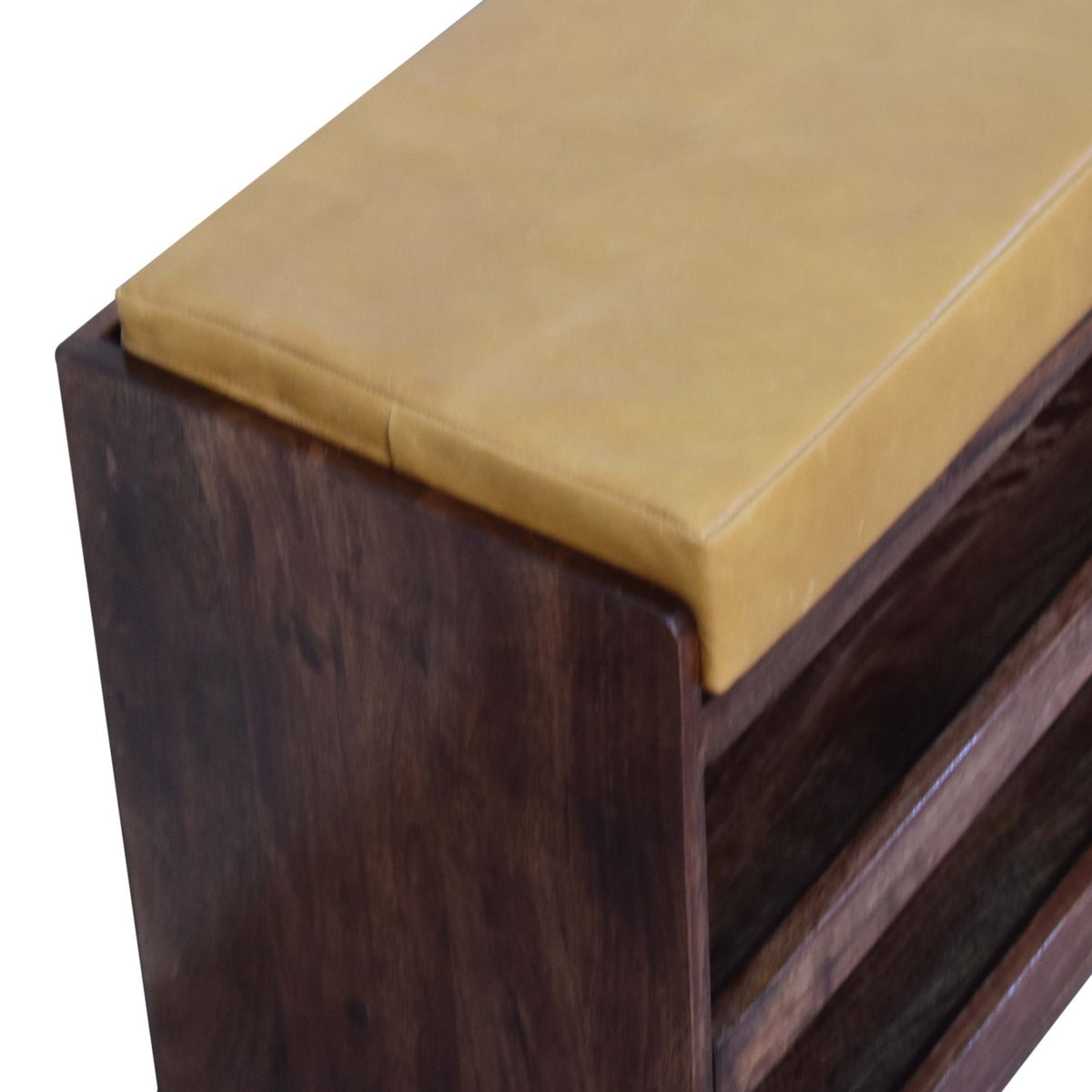Oblique close-up of the tan top and dark brown wooden side panel