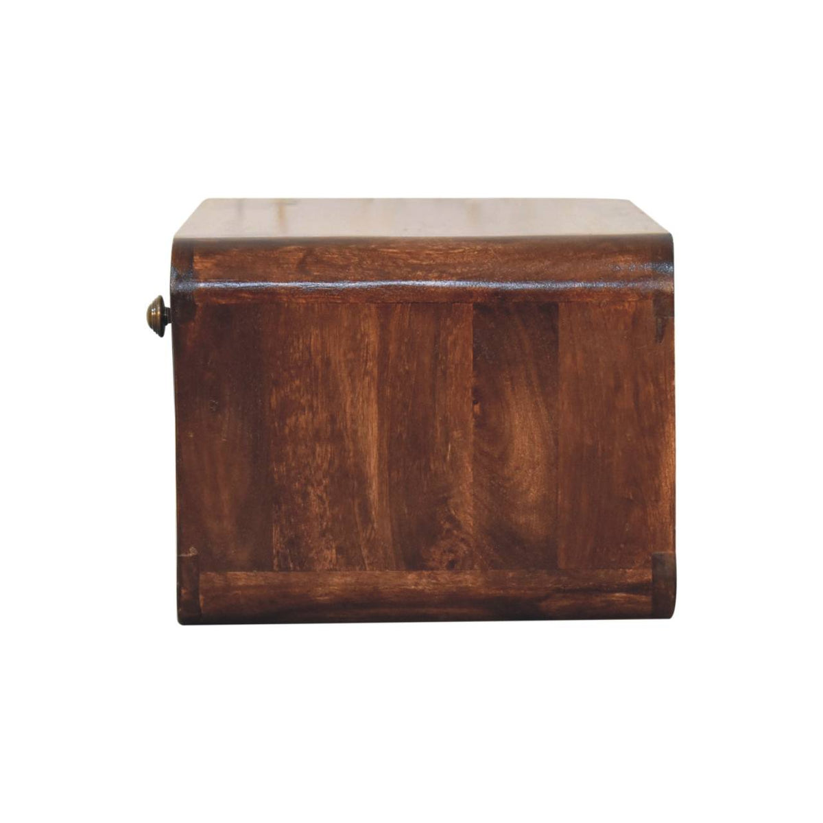 Side view showing the bedside table’s smooth wooden panel and curved edges.