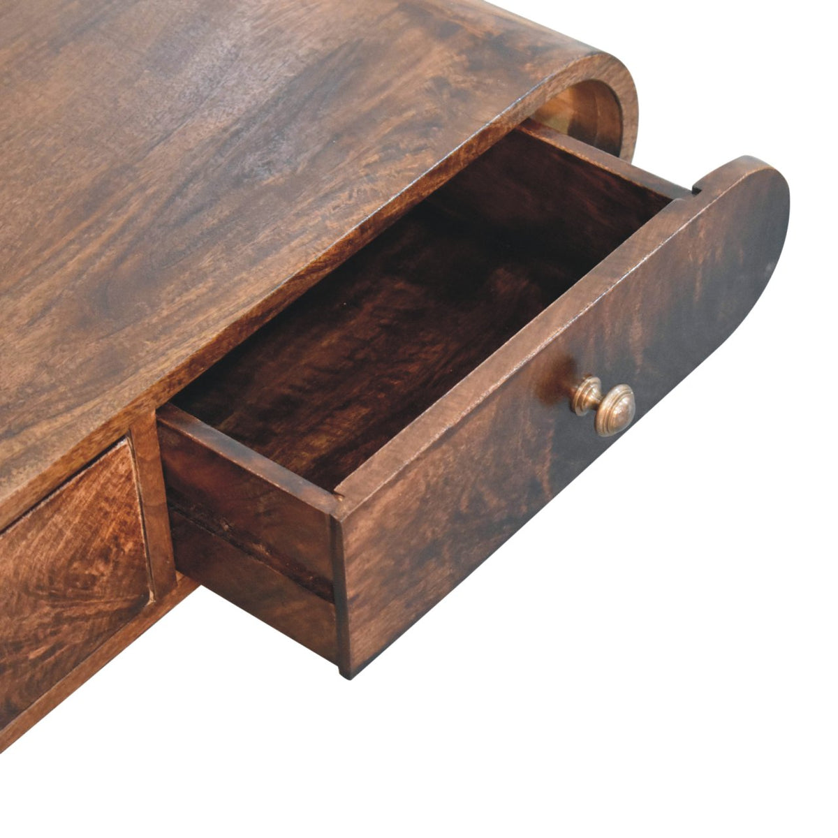 Close-up of one open drawer in the curved brown wood console table