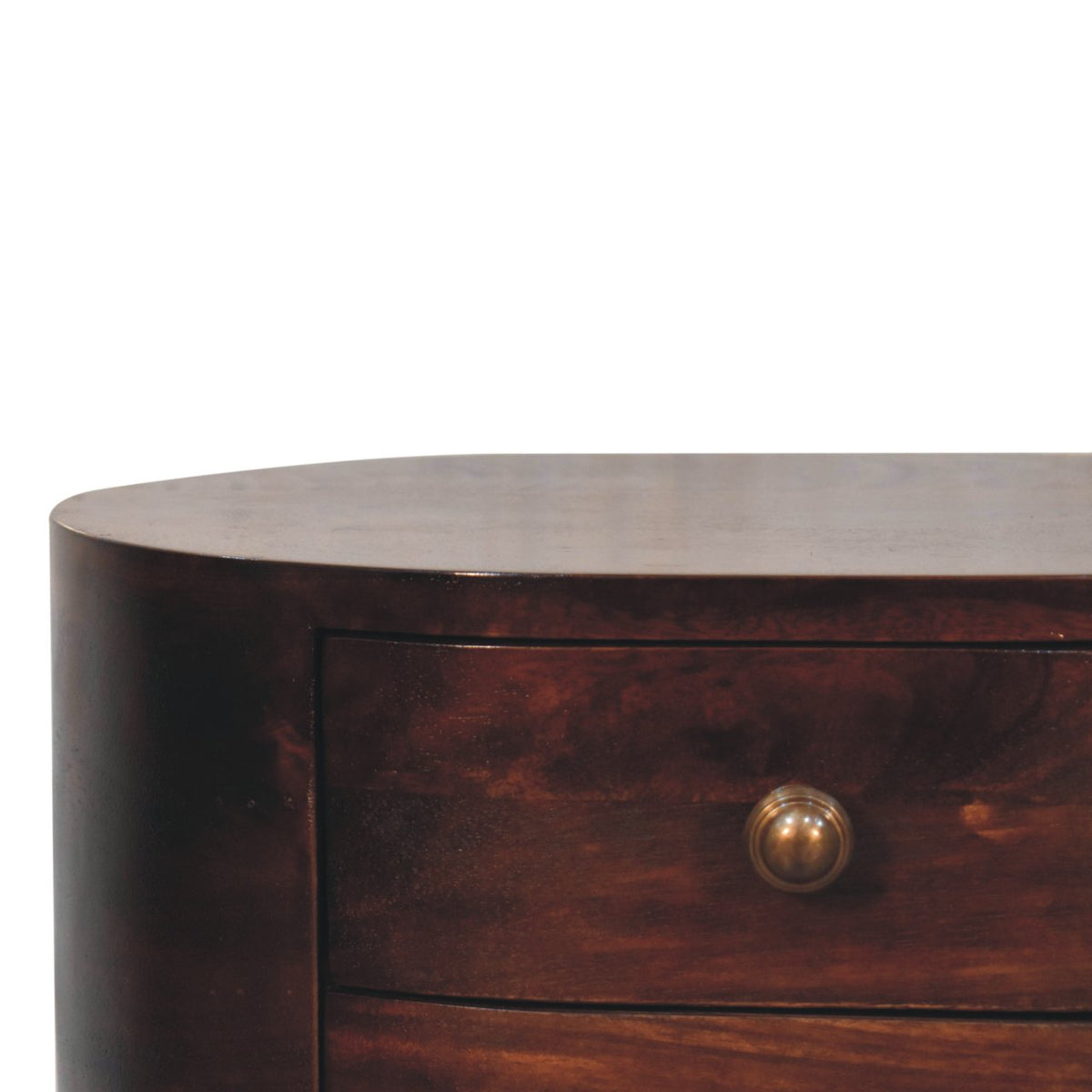 Close-up of the dark walnut table's rounded edge, drawer front and brass-colored knob