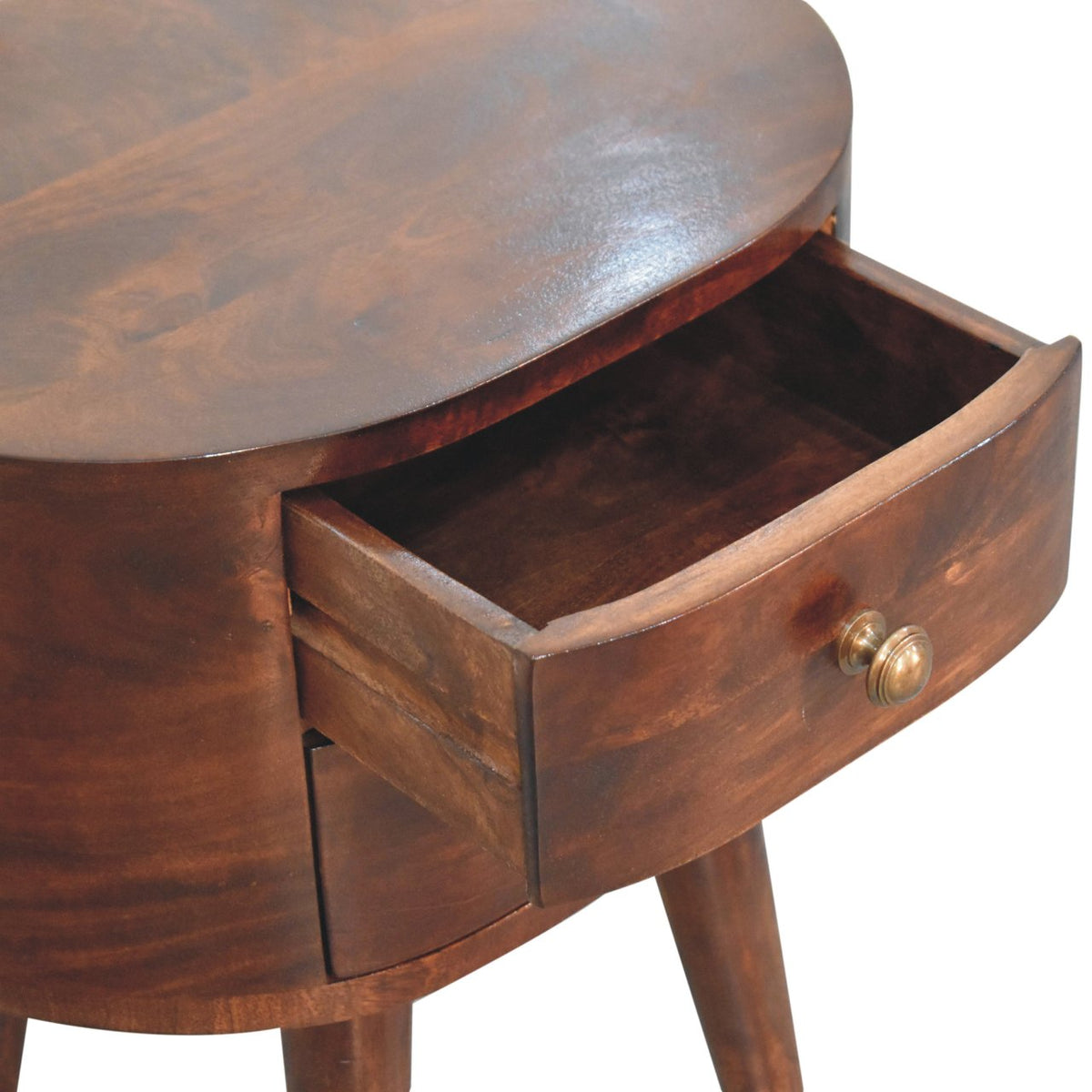 Open drawer close-up on the dark walnut bedside table, showing the drawer interior and knob