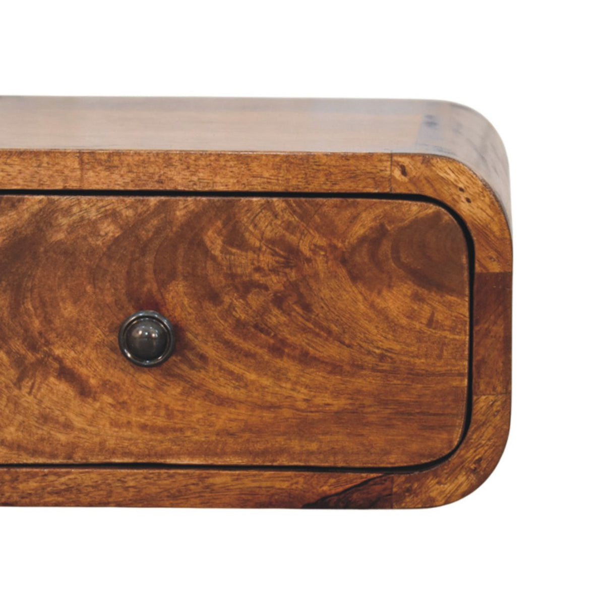 Close-up of the rounded drawer front, dark knob, and swirling wood grain.
