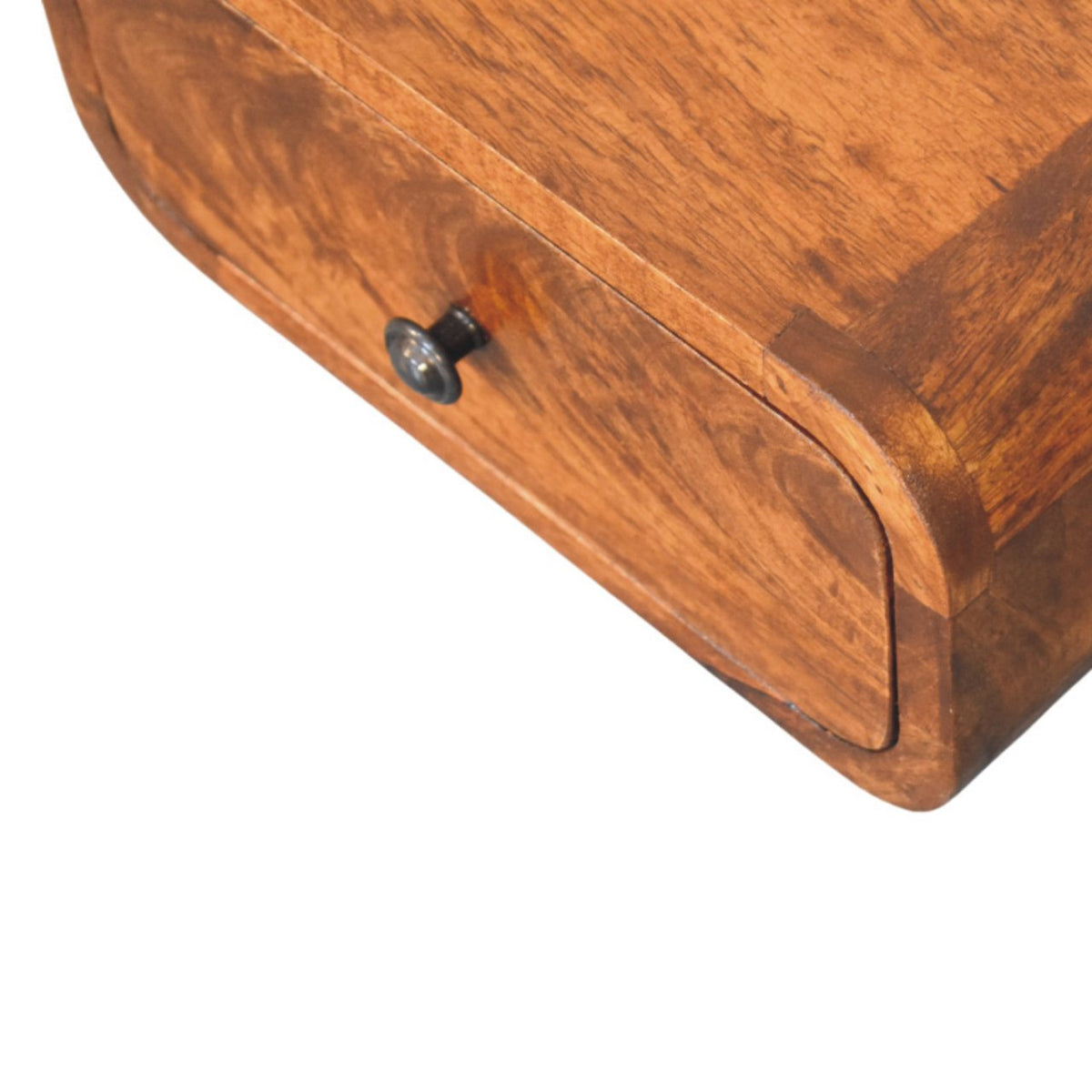 Close-up of the nightstand’s rounded drawer front, dark knob, and visible wood grain.